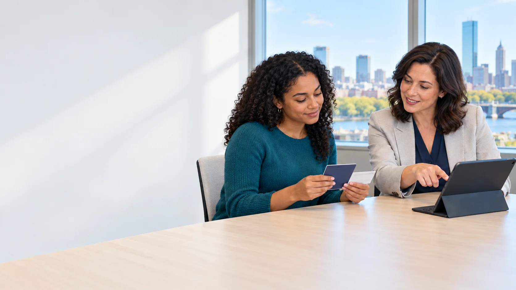 Employee and HR specialist reviewing identification documents together